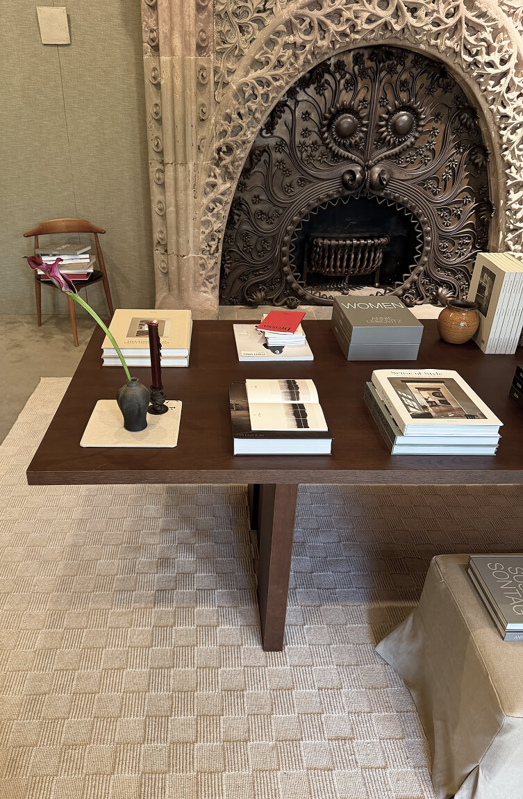 Table with My Gaudí books and ornamental fireplace Paseo de Gracia Barcelona 2026