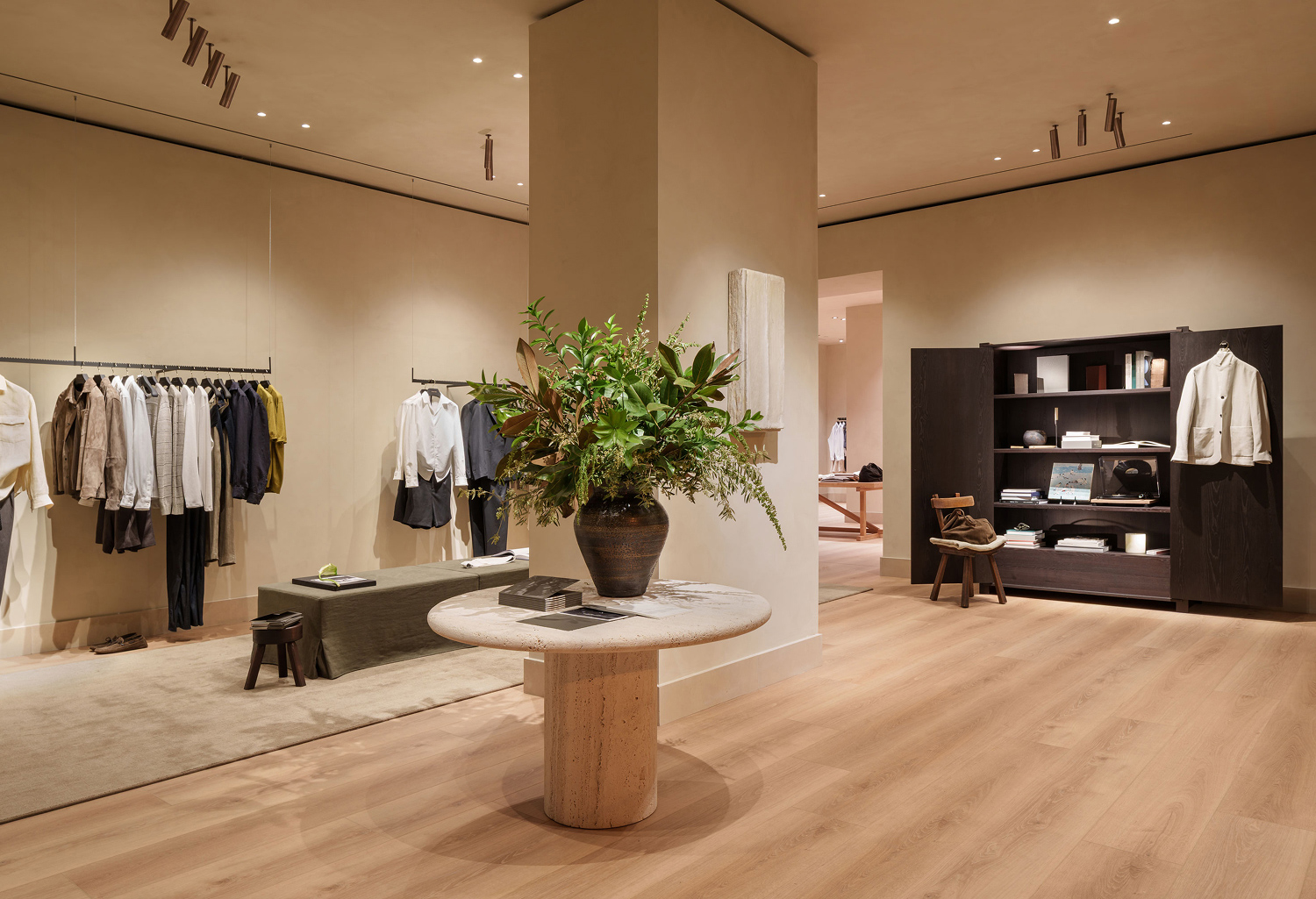 Massimo Dutti Mallorca store interior with clothing rack and plant