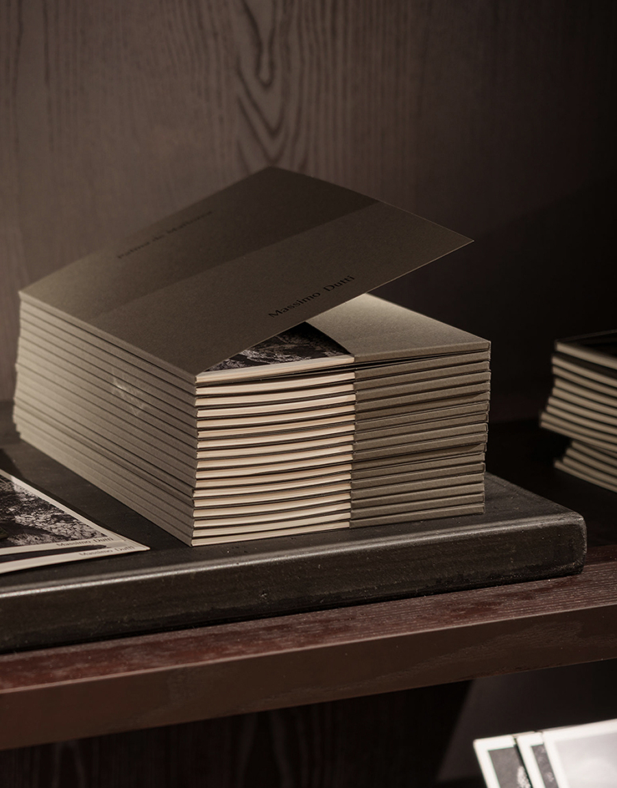 Apartamento editorial detail at Massimo Dutti Mallorca with stacked books