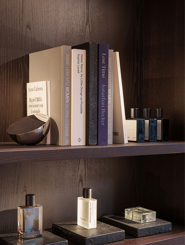 Shelf detail at Massimo Dutti Mallorca with books, perfumes and decorative objects