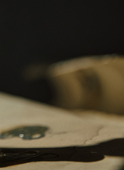 Dimly lit surface with a warm reflection — Midnight Woods, Massimo Dutti