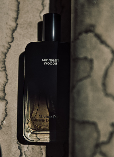Midnight Woods bottle against a cracked wall — Massimo Dutti