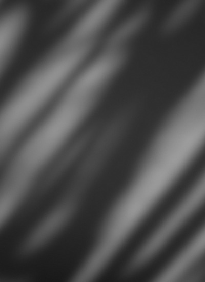 Diagonal shadows on a light surface, in black and white — Incense & Hinoki, Massimo Dutti