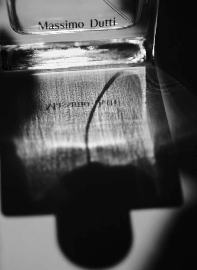 Reflection of the Massimo Dutti 1985 bottle in black and white — Massimo Dutti