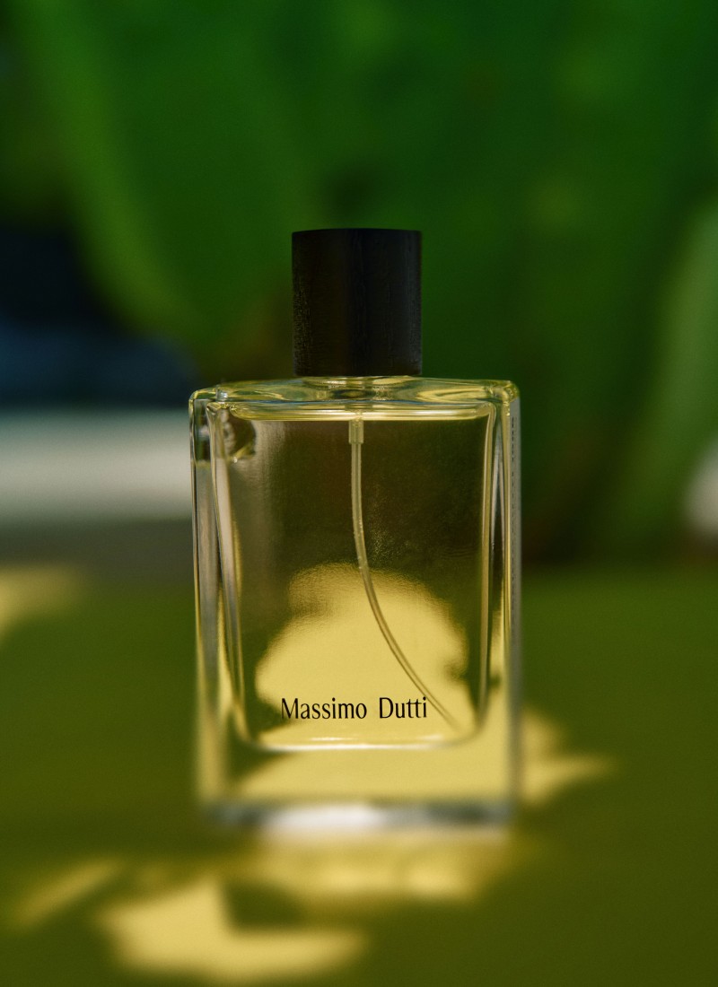 Massimo Dutti 1985 bottle against a blurred green background — Massimo Dutti