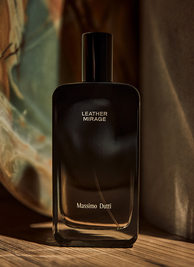 Leather Mirage bottle on wood against a veined background — Massimo Dutti