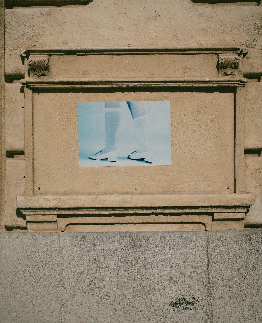 Framed work on a carved stone wall — Arles