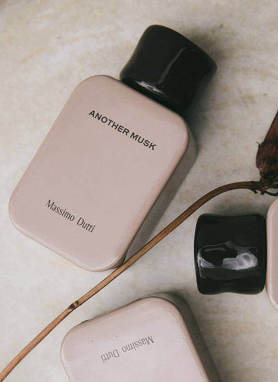 Another Musk bottle seen from above beside other bottles — Massimo Dutti