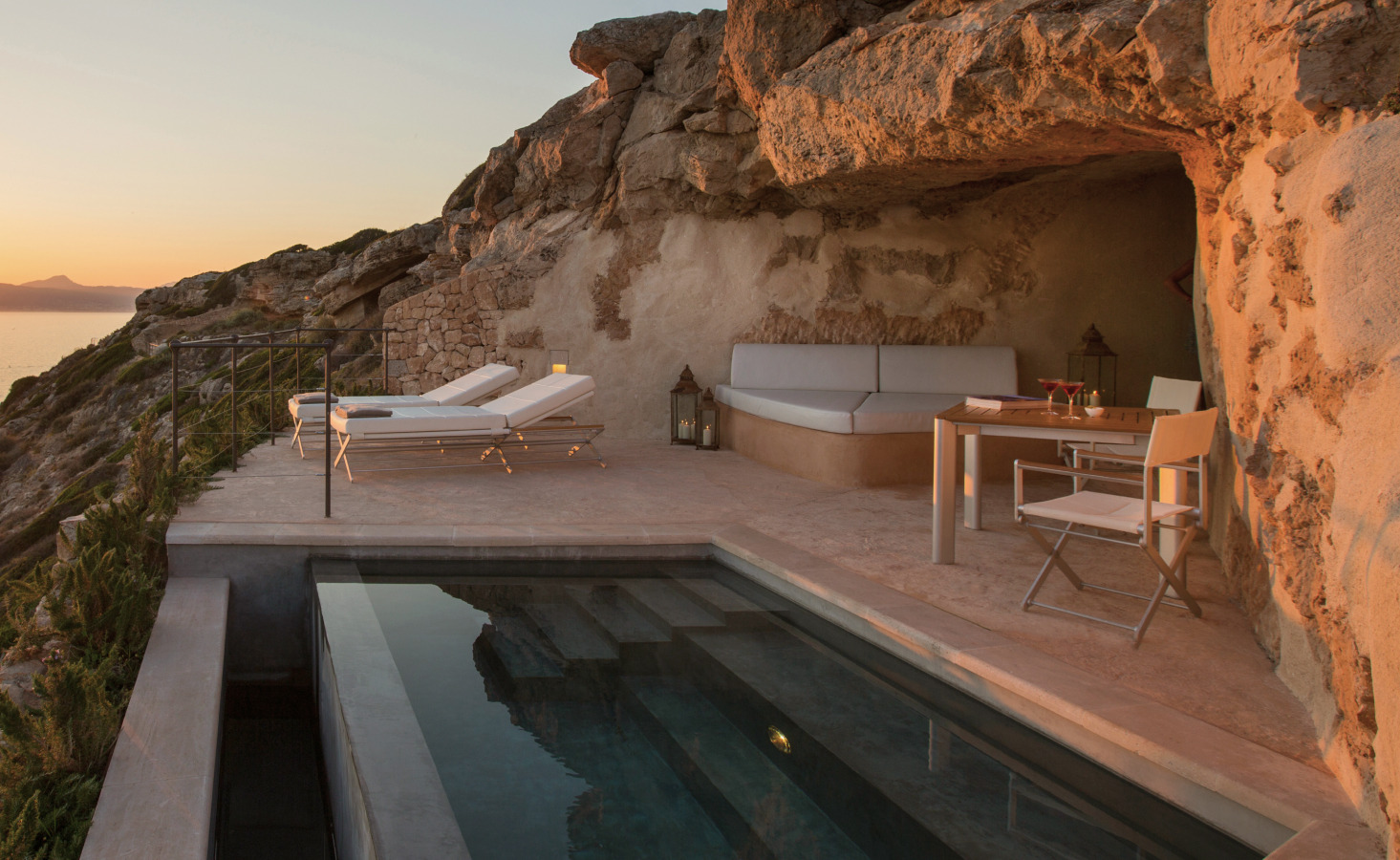 Saltwater pool carved into the rock at sunset — Cap Rocat, Mallorca