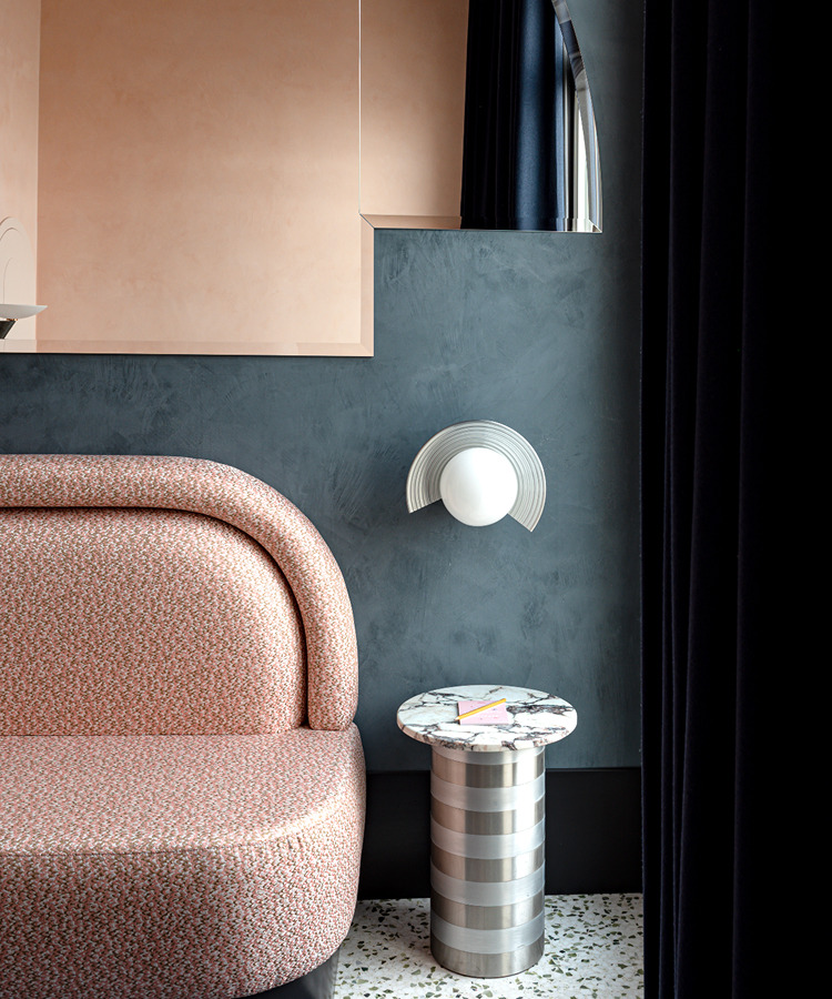 Living room with upholstered armchair and marble table — Il Palazzo Experimental, Venice