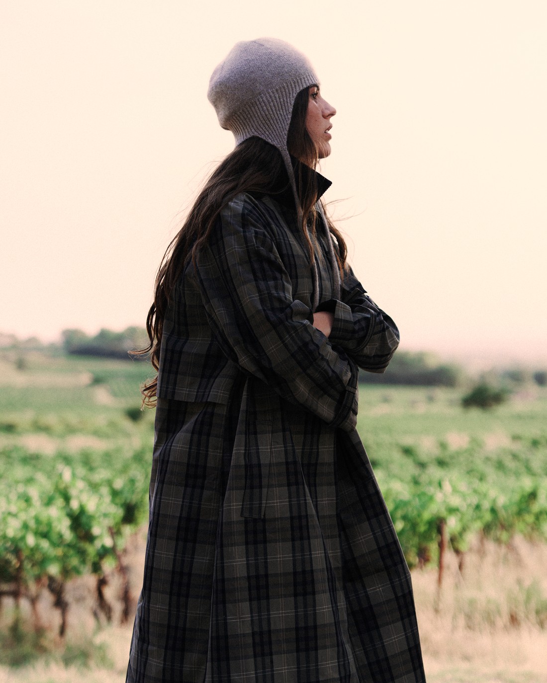 Woman in a long checked coat and knitted hat in a vineyard — Massimo Dutti Fall Treasures