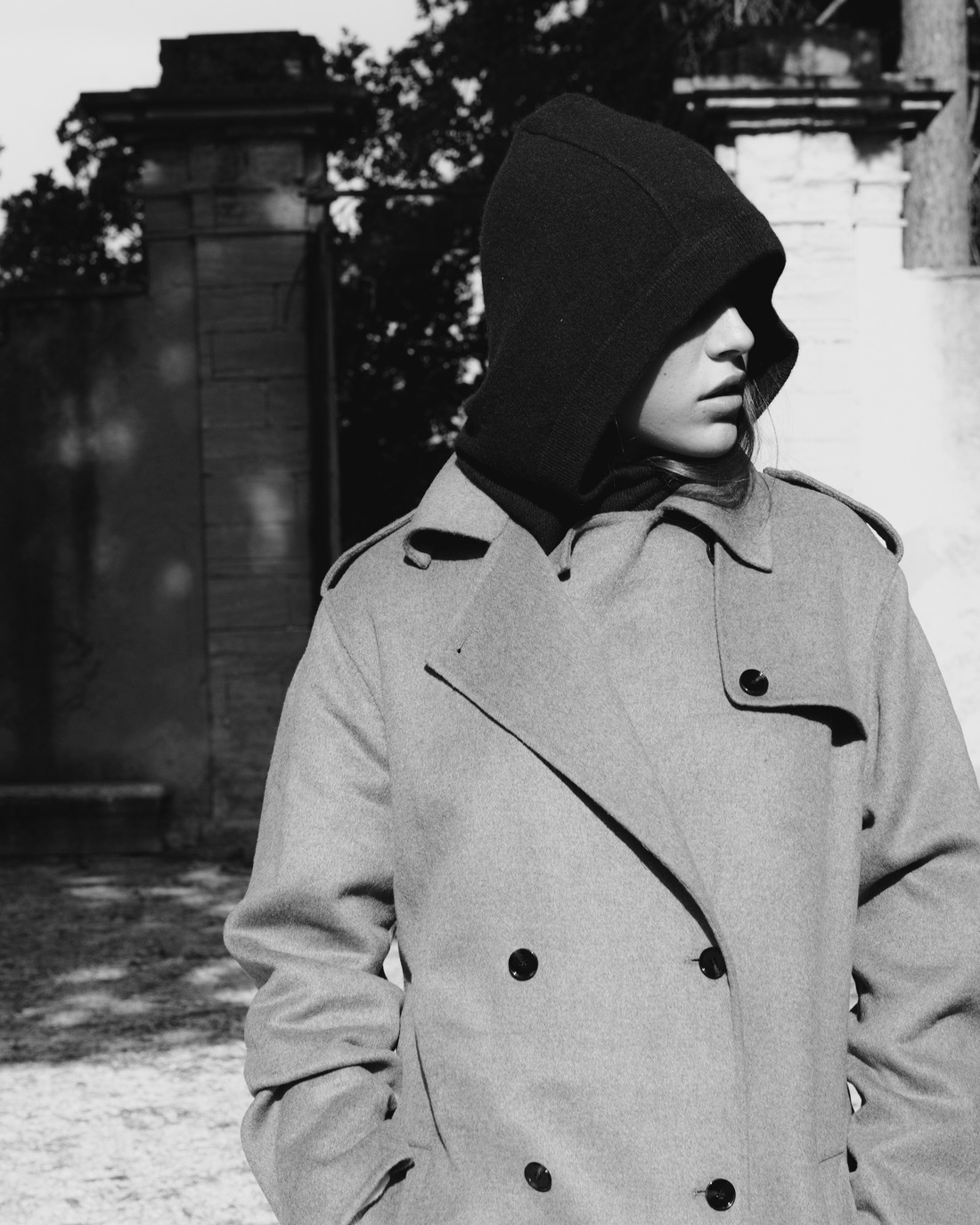 Woman in a balaclava and grey trench coat, in black and white — Massimo Dutti Fall Treasures