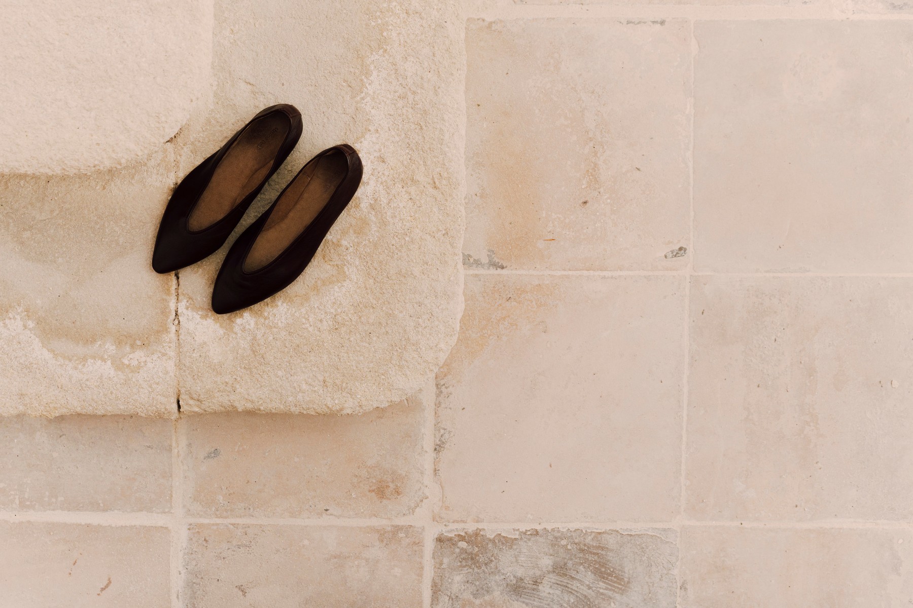Burgundy leather ballet flats on a pale stone floor — Massimo Dutti Fall Treasures