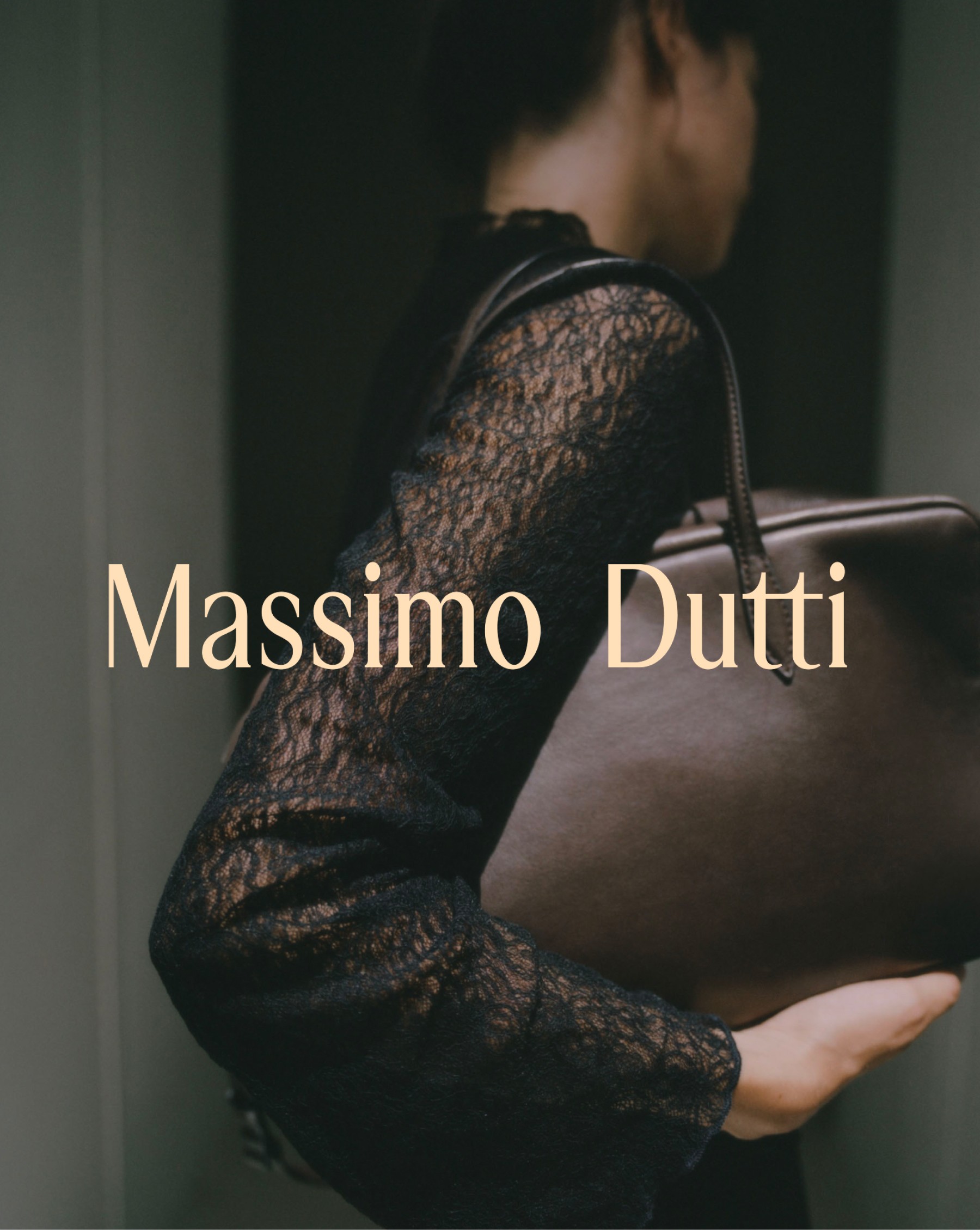 Model in a black lace T-shirt with a brown leather mini duffle bag — Massimo Dutti