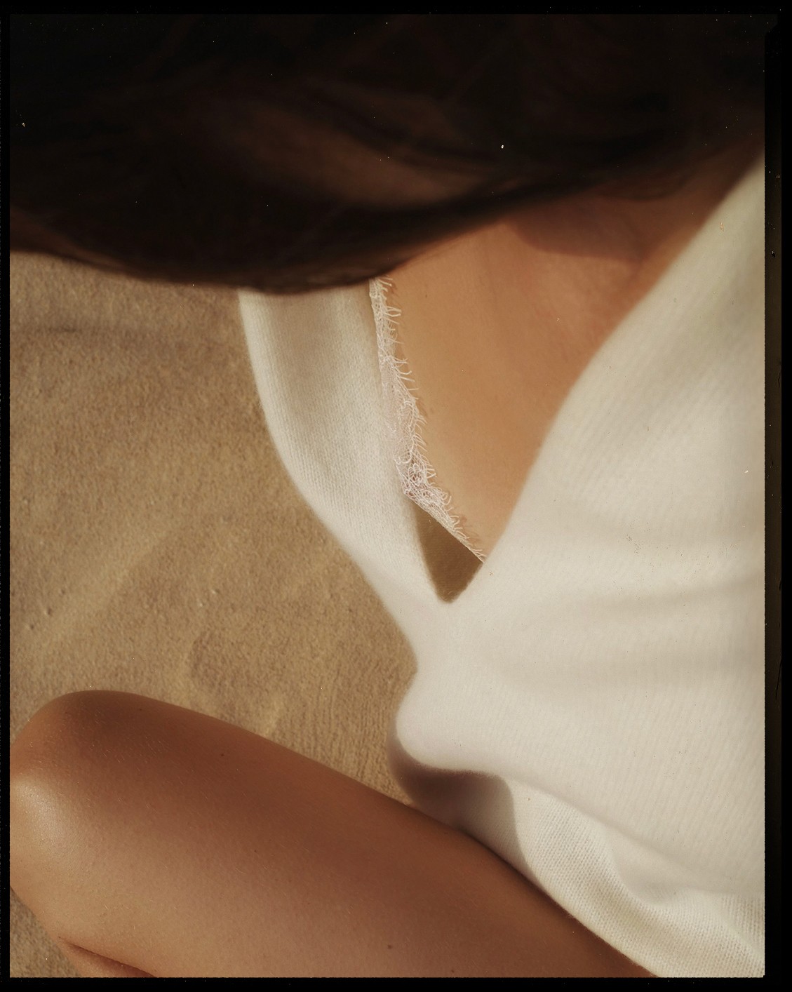 Detail of a long white sweater with neckline and lace bralette, with black frame — Massimo Dutti