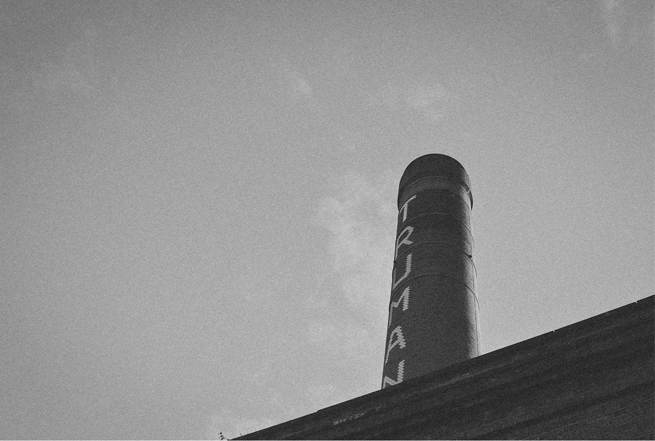 Brick chimney against the sky in Shoreditch — Massimo Dutti London Fashion Week