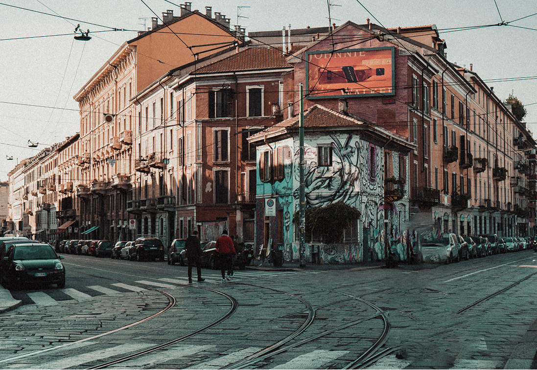 Street corner with graffiti and tram tracks at a Milan crossroads — Massimo Dutti Milan Fashion Week