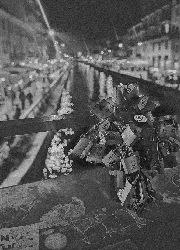 Love locks on a canal railing at night, in black and white — Massimo Dutti Milan Fashion Week