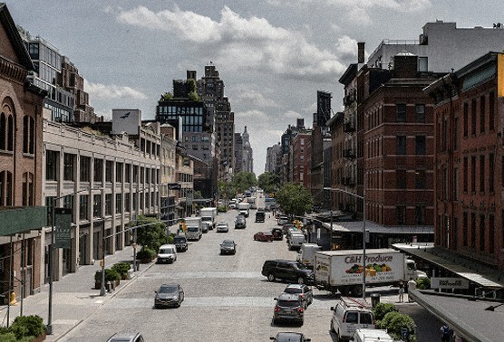 A Meatpacking District street with traffic and brick buildings — Massimo Dutti NY Fashion Week