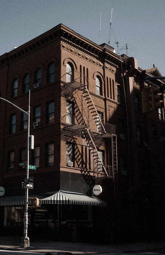Brick corner with fire escapes in Nolita — Massimo Dutti NY Fashion Week