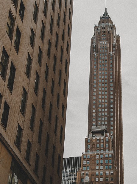 The Metropolitan Life Insurance Tower between brick buildings — Massimo Dutti NY Fashion Week