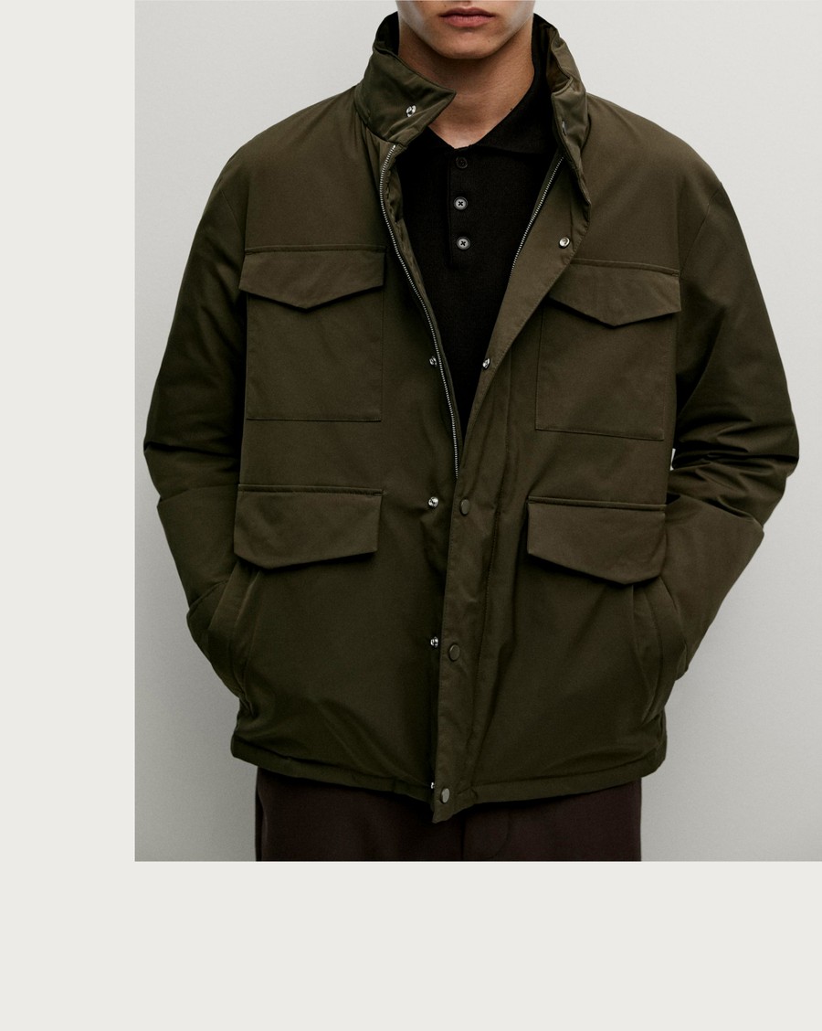 Man wearing a khaki puffer jacket with flap pockets — Massimo Dutti Puffer Jackets