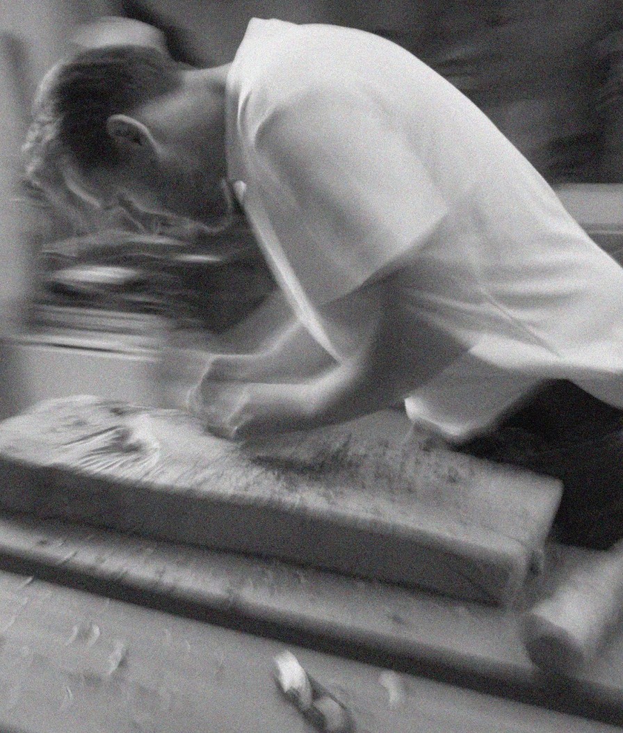 Igor Polasiak working on a wooden piece in his studio