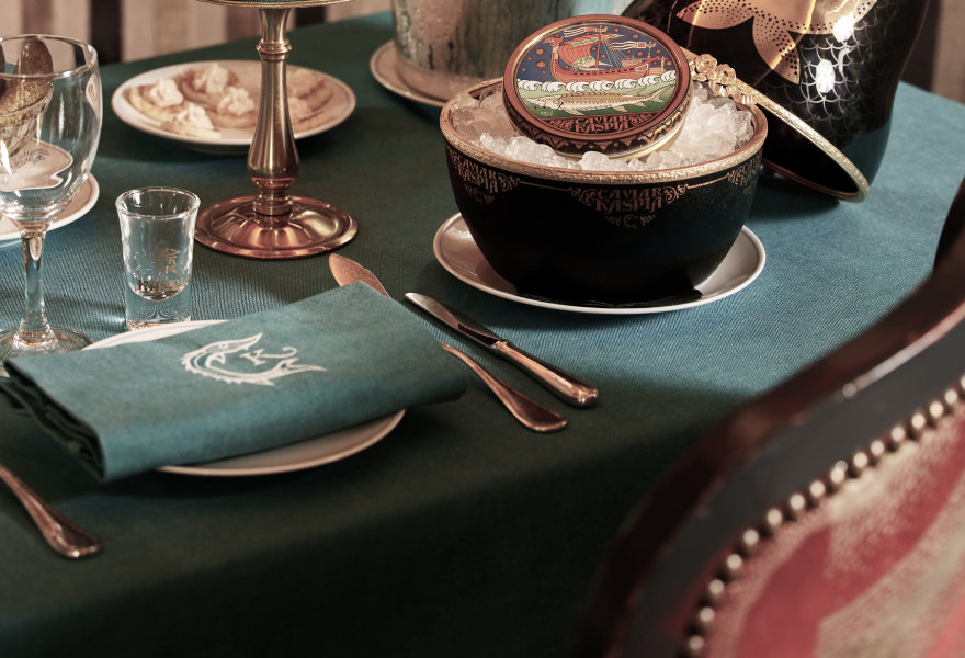Table with caviar and green tablecloth at Caviar Kaspia — Massimo Dutti Paris Fashion Week
