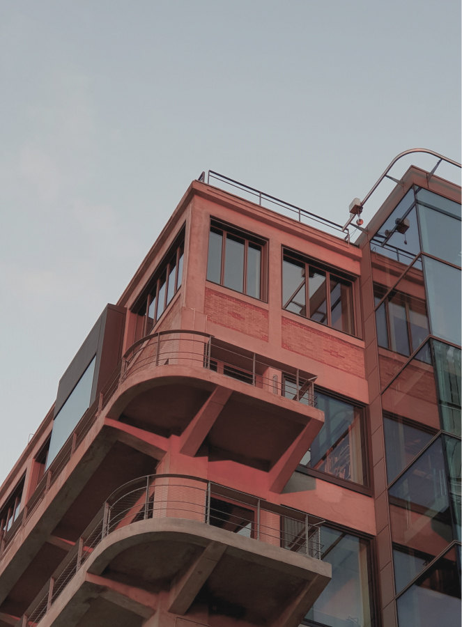 Contemporary red-façade building in Pantin — Massimo Dutti Paris Fashion Week