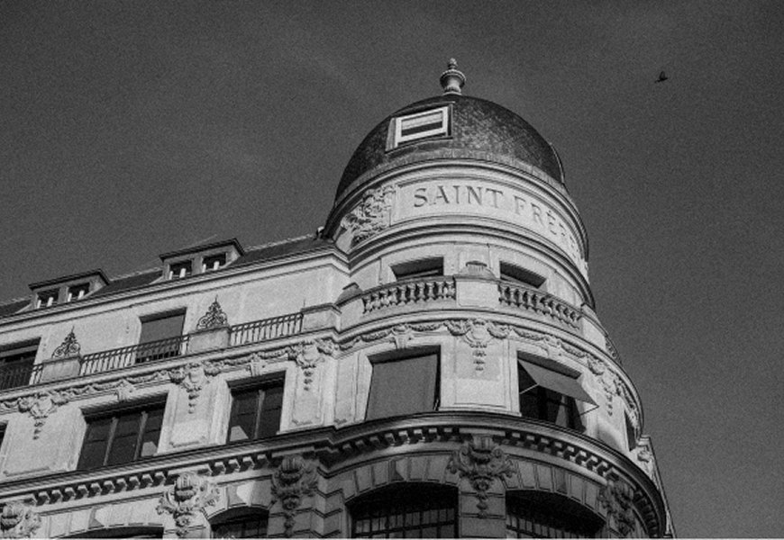 Domed façade of a historic Left Bank building, in black and white — Massimo Dutti Paris Fashion Week