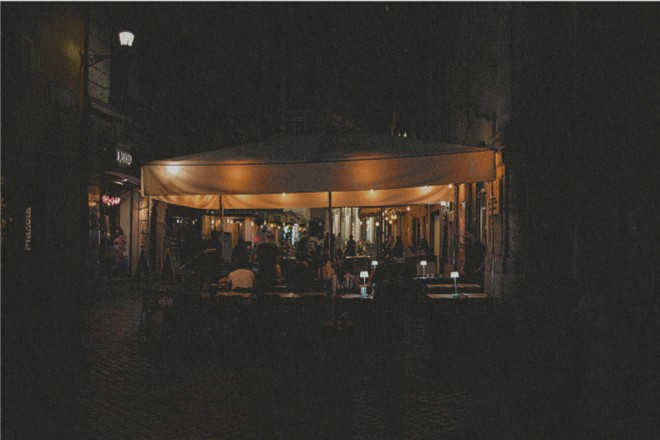Restaurant lit up at night in Rome