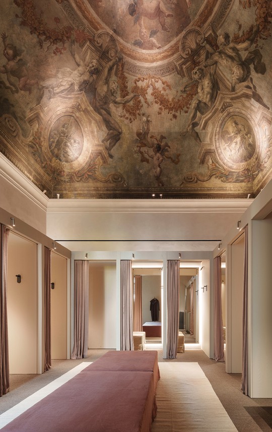 Fitting room corridor with curtains beneath restored ceiling frescoes — Massimo Dutti Rome