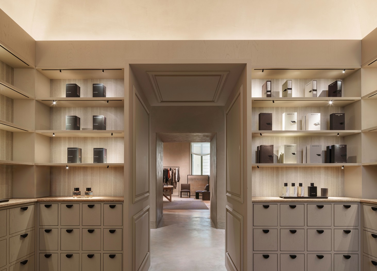 Perfume shelves on either side of the door to The Perfumes Room — Massimo Dutti Rome