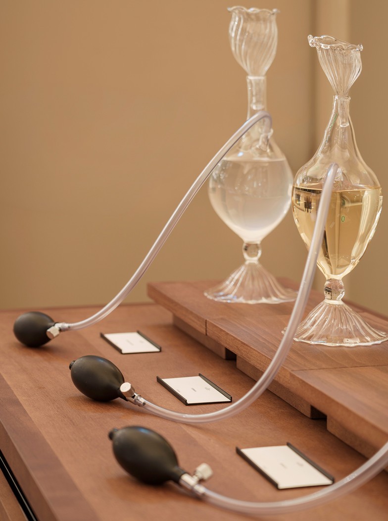 Blown-glass testers on the counter of The Perfumes Room — Massimo Dutti Rome