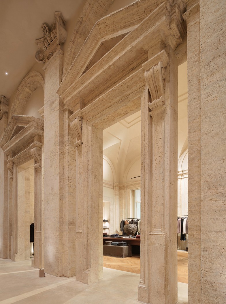 Travertine columns and pilasters in the menswear room — Massimo Dutti Rome