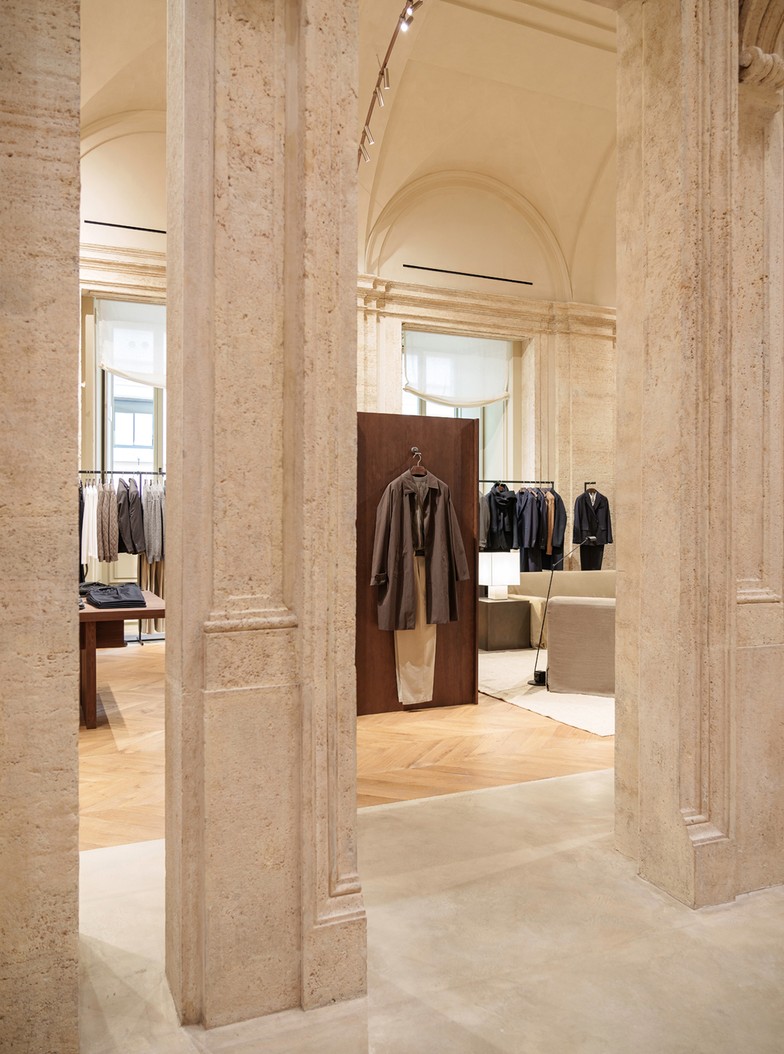 View between pilasters towards the menswear rails — Massimo Dutti Rome